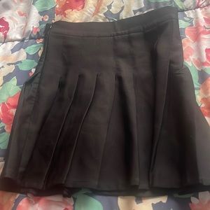 black pleated skirt